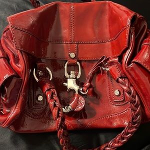 Francesco Biasia red patent leather handbag. Never used. Pockets galore! Beauty!